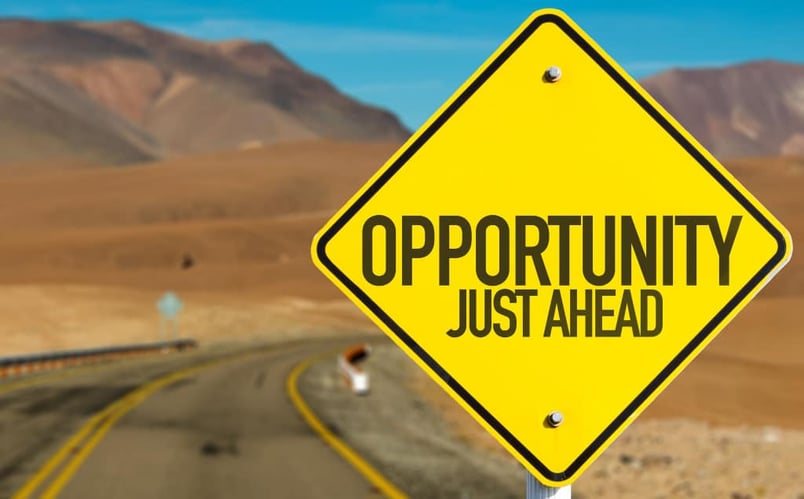 Road sign reading “OPPORTUNITY JUST AHEAD,” signifying the use of AI in law)